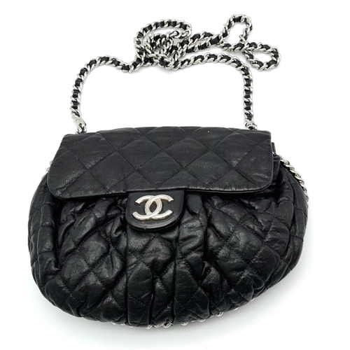 9 - A Black Chanel Quilted Leather CC Shoulder Bag with Flap Chain surrounding it. One main compartment ... 