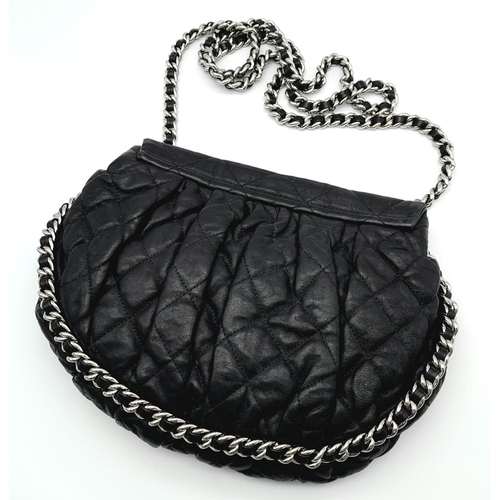 9 - A Black Chanel Quilted Leather CC Shoulder Bag with Flap Chain surrounding it. One main compartment ... 