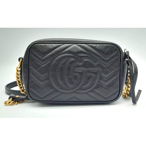 90 - A Black GUCCI GG Marmont Matelasse Mini Leather Crossbody bag. Come with gold-tone hardware and Inte... 