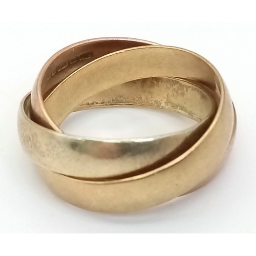 106 - A 9 K yellow and rose gold triple band ring, size: J, weight: 5 g.