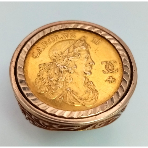 8 - A Commemorative Charles II Gold Sovereign Ring. Set in decorative scrolled 9K gold. Size R/S. 16.7g ... 