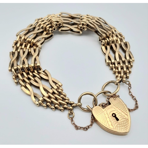 18 - A Beautifully Constructed 9K Yellow Gold Gate Bracelet with Heart Clasp. 18cm. 28.06g weight.