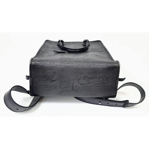 30 - A Berluti Black Leather Satchel. Exterior in scritto leather design with zipped pocket. Spacious bei... 