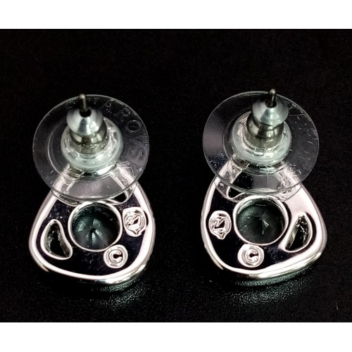 1355 - A Pair of Swarovski Crystal Earrings and a Swarovski Brooch. As new, in original packaging with COA'... 