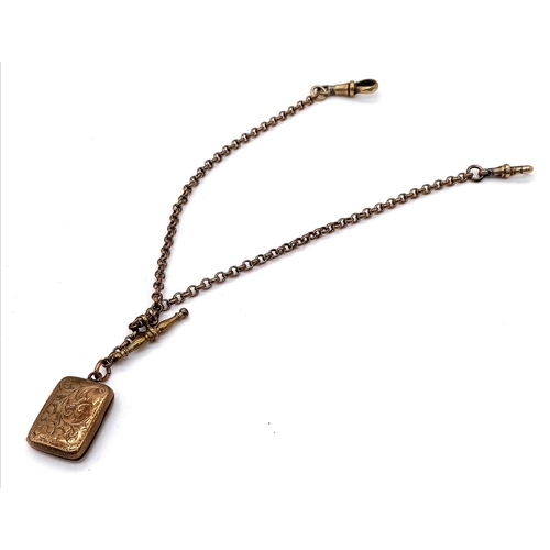 10 - An Antique 9K Gold Vinaigrette Booklet Pendant on an Antique 9K Gold Fob Chain. 13g total weight.