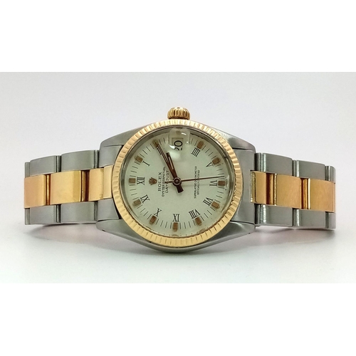 100 - A BI-METAL ROLEX OYSTER PERPETUAL DATEJUST MIDSIZE WATCH. Bi-metal bracelet and case - 31 mm. 18K ye... 