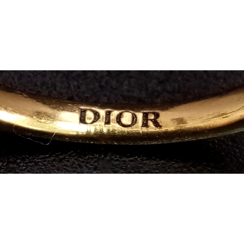 104 - An iconic and rare, three finger CHRISTIAN DIOR spell-out ring designed by John Galliano, one of the... 