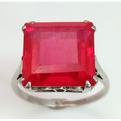 132 - A high quality ruby platinum ring, with a large (6.3 carats (appr), square, step cut, pigeon blood r... 