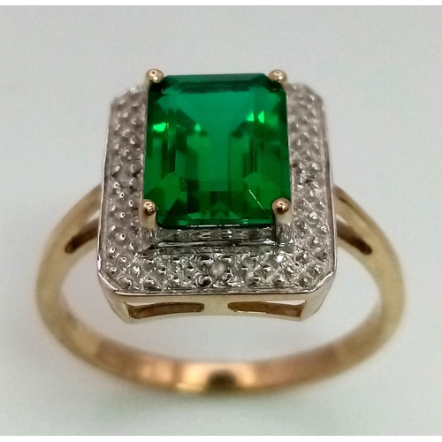 167 - A 9 K yellow and white gold ring with an emerald cut synthetic, flawless emerald. Fully British hall... 