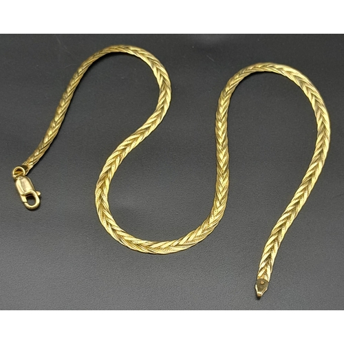 17 - A Vintage 9K Yellow Gold Woven Link Necklace. 40cm.
7.5g weight.