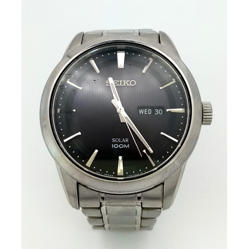 188 - A gents SEIKO, solar powered, dress watch, 42 mm case, black dial with date/day window, “Hardlex” gl... 