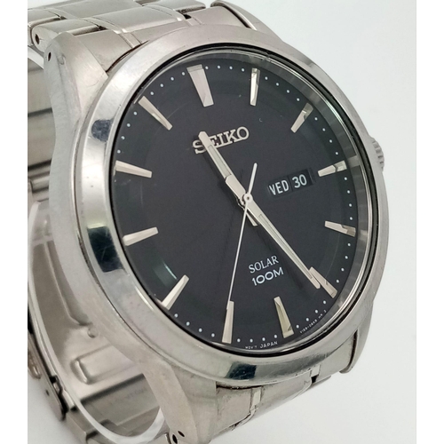 188 - A gents SEIKO, solar powered, dress watch, 42 mm case, black dial with date/day window, “Hardlex” gl... 