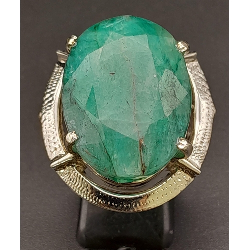 302 - A 50ct Brazilian Oval Cut Emerald Ring. Set in 925 Sterling Silver. Size P. Comes with a presentatio... 