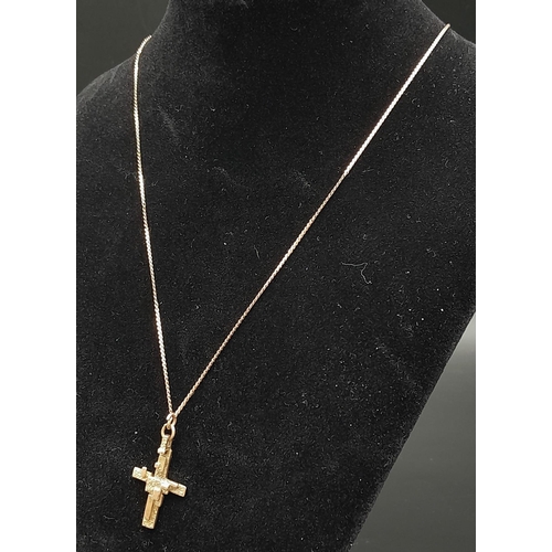 502 - An Abstract 9K Gold Crucifix Pendant on a 9K Yellow Gold Disappearing Necklace. 3cm and 48cm. 5g tot... 