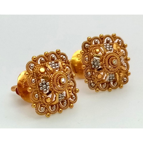 51 - A Pair of Asian Inspired 22k Yellow and White Gold Earrings.
3.4g total weight. Comes with fitted ca... 