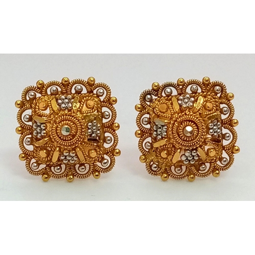 51 - A Pair of Asian Inspired 22k Yellow and White Gold Earrings.
3.4g total weight. Comes with fitted ca... 