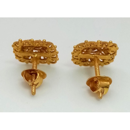 51 - A Pair of Asian Inspired 22k Yellow and White Gold Earrings.
3.4g total weight. Comes with fitted ca... 