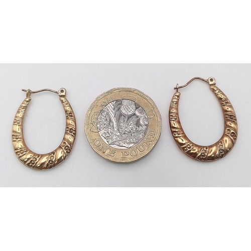 529 - A Pair of Vintage 9K Yellow Gold Horse-Shoe Hoop Earrings.
1g total weight.