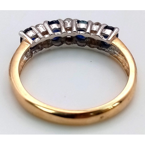 596 - A 9K Yellow Gold Sapphire and Diamond Ring. Four oval sapphires separated by six round cut diamonds.... 