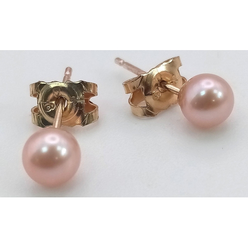 631 - A Pair of 9K Yellow Gold Small Cultured Pink Pearl Earrings. 
0.6g total weight. As new.