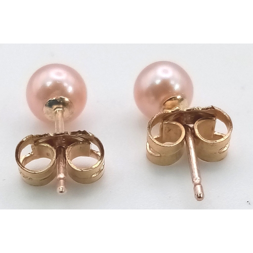 631 - A Pair of 9K Yellow Gold Small Cultured Pink Pearl Earrings. 
0.6g total weight. As new.