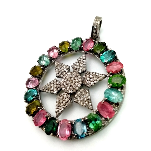 667 - A Multi-Coloured Tourmaline & Diamond Pendant. Central diamond encrusted star within a tourmaline ha... 