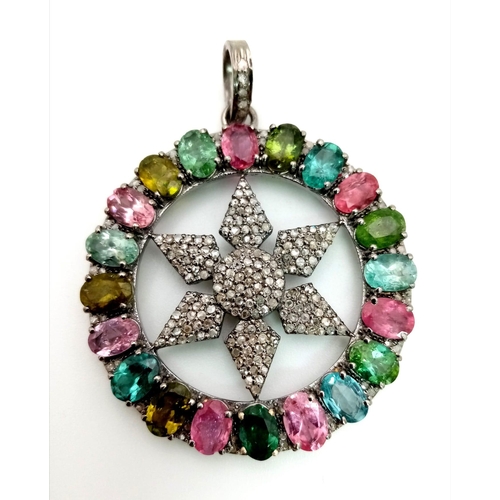 667 - A Multi-Coloured Tourmaline & Diamond Pendant. Central diamond encrusted star within a tourmaline ha... 