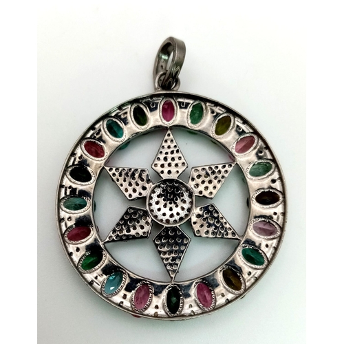 667 - A Multi-Coloured Tourmaline & Diamond Pendant. Central diamond encrusted star within a tourmaline ha... 