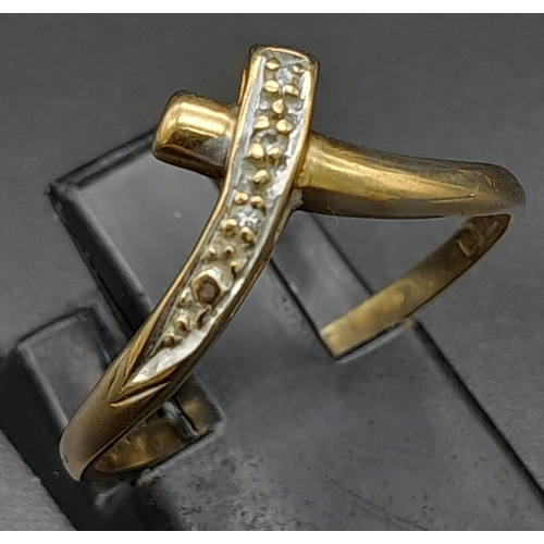 681 - A Vintage 9K Yellow Gold Diamond Crossover Ring. Size P. 1.36g total weight.