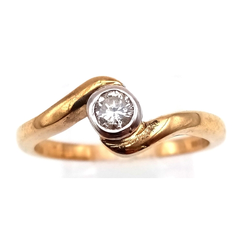 750 - A 9K Yellow Gold Diamond Crossover Ring. 0.2ct diamond. Size P. 2.95g total weight. Full UK hallmark... 