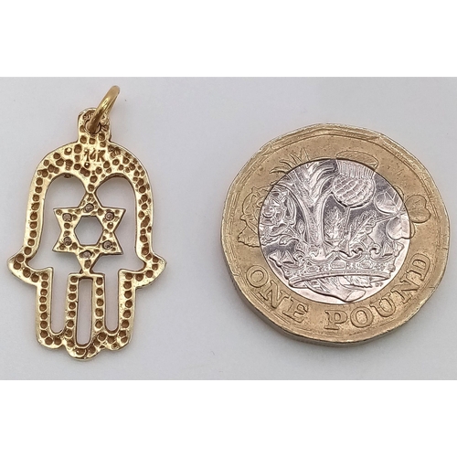 764 - A 9K Yellow Gold and White Stone Star of David Hamsa Pendant. 3cm. 2.15g weight.