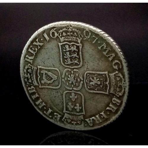 800 - A William III 1697 Silver Shilling Coin. 1st bust. S3497. Please see photos for conditions.