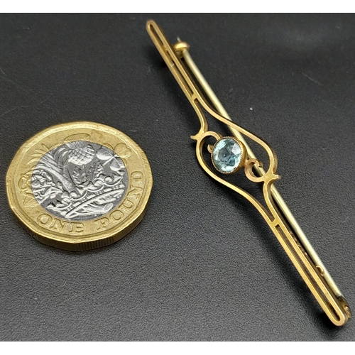 81 - An Antique 9K Yellow Gold Aquamarine Bar Brooch. Pin has been replaced. 6.5cm. 2.85g total weight