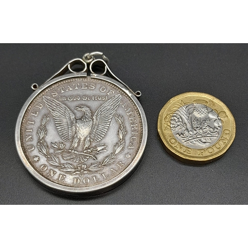 836 - AN 1884 SILVER DOLLARIN A SILVER PENDANT SETTING . 31.2gms   (GOOD DEFINITION FOR AGE)