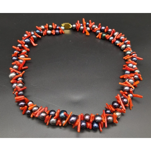 160 - A fabulous, two strand necklace with quality black Tahitian pearls and genuine red corals. Necklace ... 