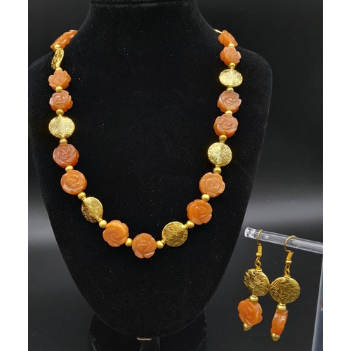 202 - An elegant and sophisticated, carved carnelian and vermeil necklace and earrings set . Necklace leng... 