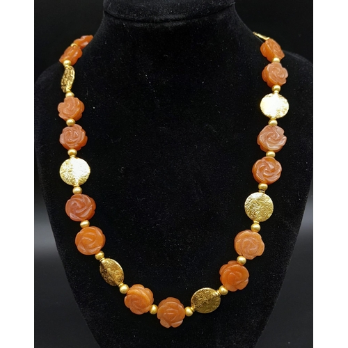 202 - An elegant and sophisticated, carved carnelian and vermeil necklace and earrings set . Necklace leng... 