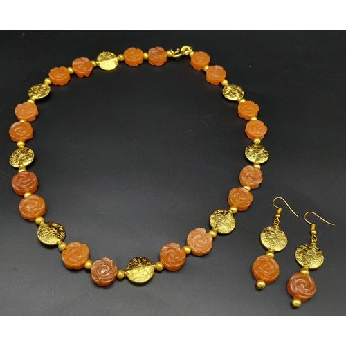 202 - An elegant and sophisticated, carved carnelian and vermeil necklace and earrings set . Necklace leng... 