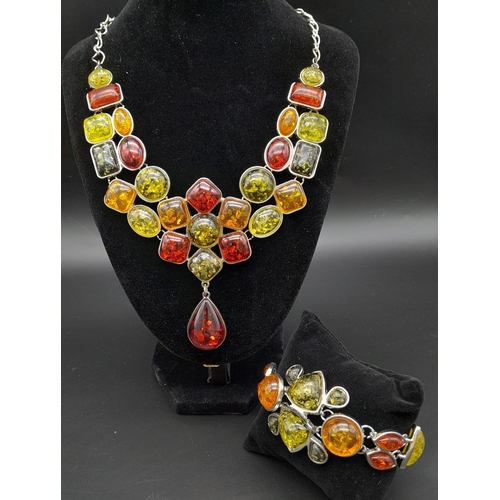 223 - A regal, white metal (untested), multi-coloured amber necklace and bracelet set. Total weight: 110 g... 