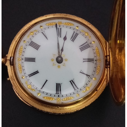 243 - An 18K Gold Half Hunter Pocket Watch with green enamel foilage decoration. 35mm diameter, white dial... 