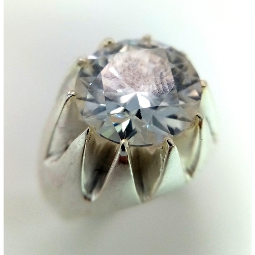 227 - A Dazzling 6.65ct White Moissanite Ring. Set in 925 Silver. Size T. 15.35g total weight. Comes with ... 