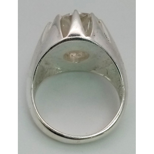 227 - A Dazzling 6.65ct White Moissanite Ring. Set in 925 Silver. Size T. 15.35g total weight. Comes with ... 