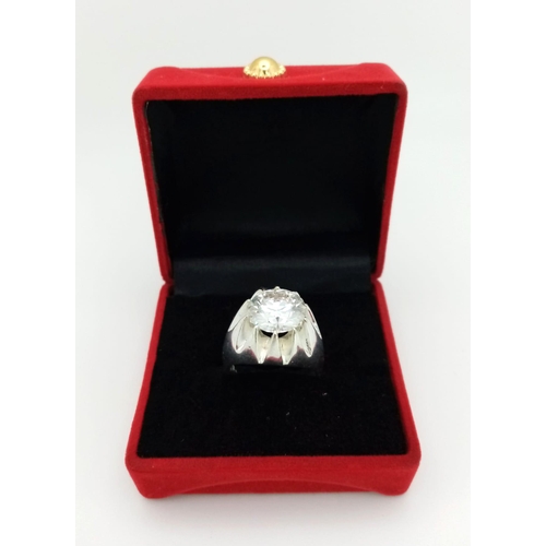 227 - A Dazzling 6.65ct White Moissanite Ring. Set in 925 Silver. Size T. 15.35g total weight. Comes with ... 