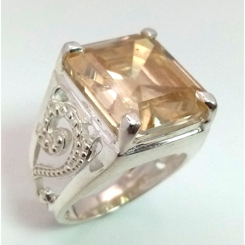 318 - A Heavenly 19.60ct Champagne Moissanite Ring set in 925 Silver. Rectangular-cut gemstone. Comes with... 