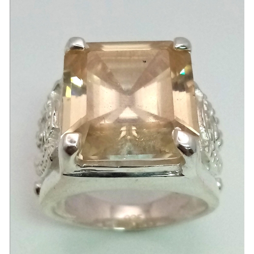 318 - A Heavenly 19.60ct Champagne Moissanite Ring set in 925 Silver. Rectangular-cut gemstone. Comes with... 