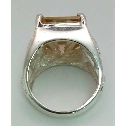 318 - A Heavenly 19.60ct Champagne Moissanite Ring set in 925 Silver. Rectangular-cut gemstone. Comes with... 