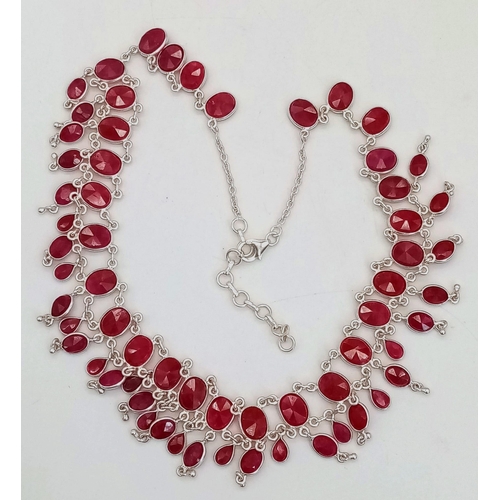 407 - A Ruby Gemstone Choker Necklace set in 925 Silver. Two rows of oval cut rubies. 38.58g total weight.... 