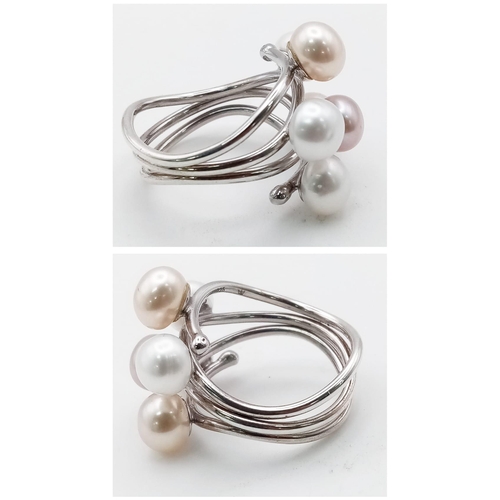 424 - A Tri-Coloured Pearl Ring. Wave pattern pearls set in white metal. Size Q. Ref: 11774