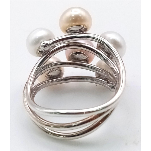 424 - A Tri-Coloured Pearl Ring. Wave pattern pearls set in white metal. Size Q. Ref: 11774