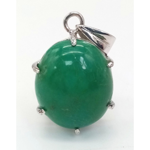 571 - An Oval Turquoise Cabochon Pendant. Set in 925 Sterling Silver. 7.80g. 4cm